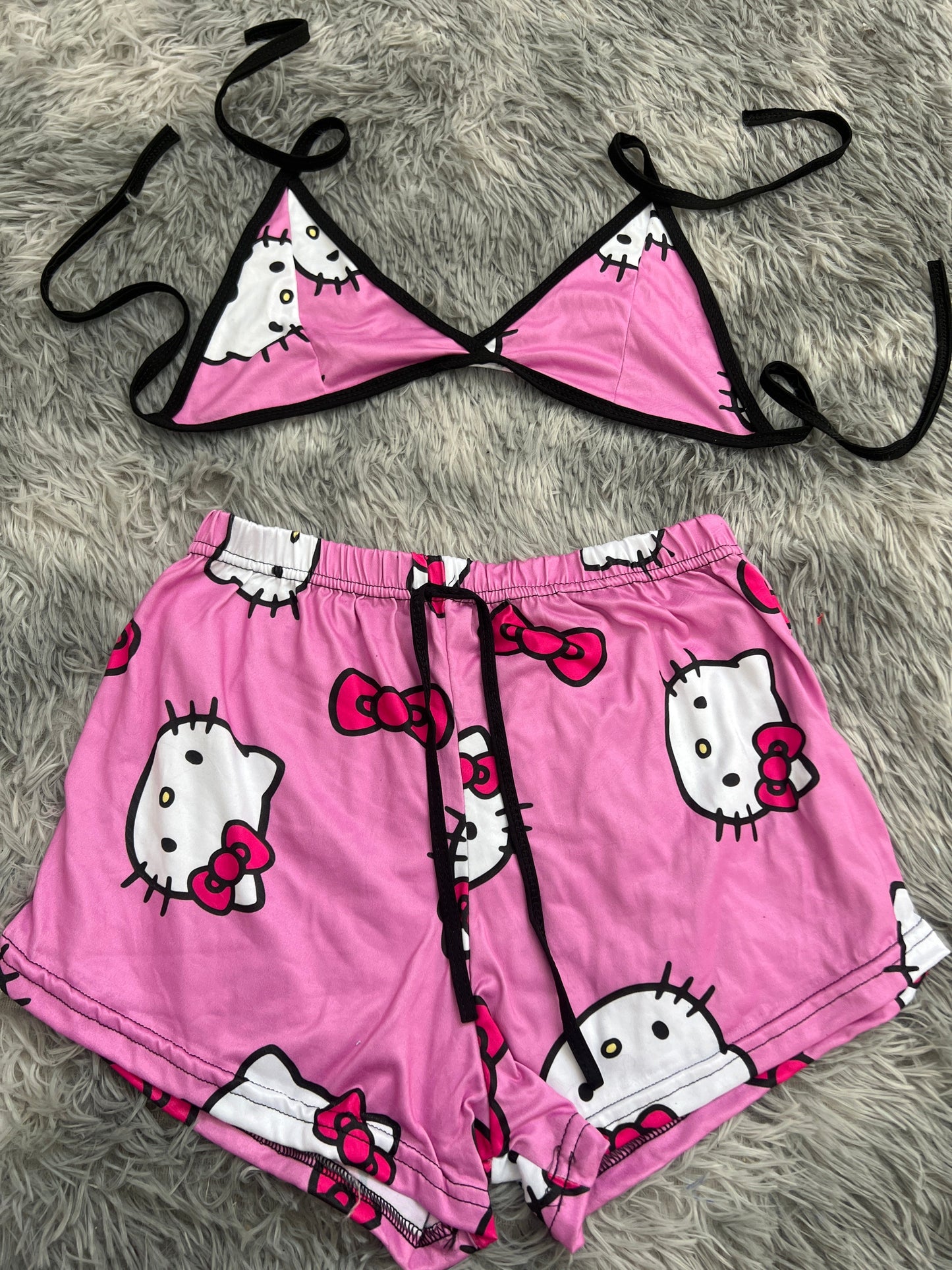 Kitty caras fondo rosa top con short unitalla de brush