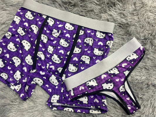 Hello kitty fondo morado duo de tanga XL