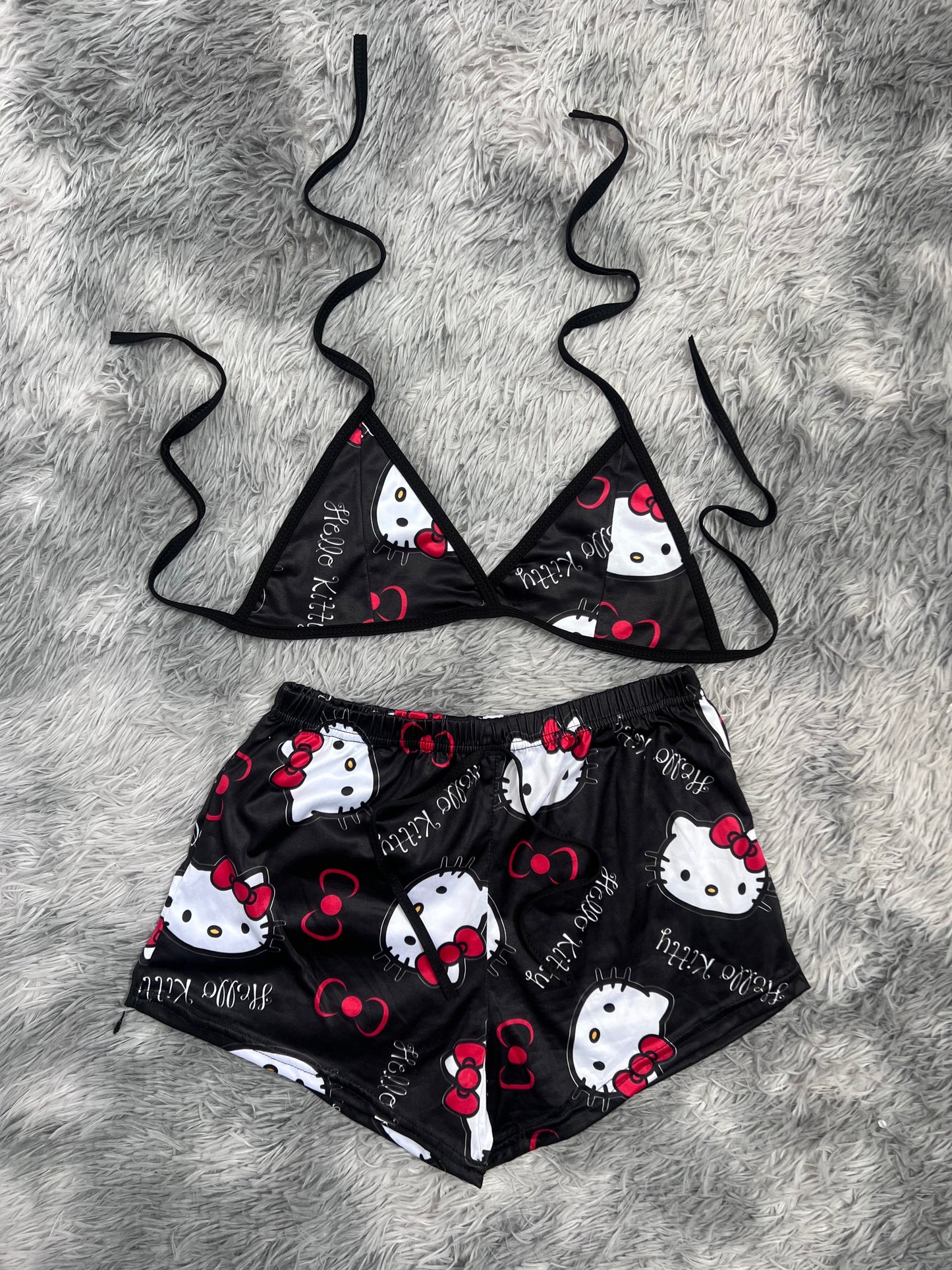 hello kitty nombre fondo negro top con short unitalla de brush