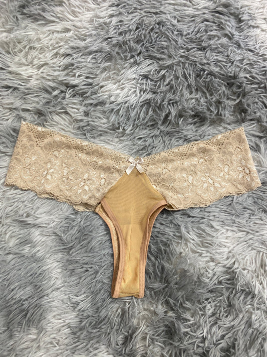 Tanga de dama con moño beige