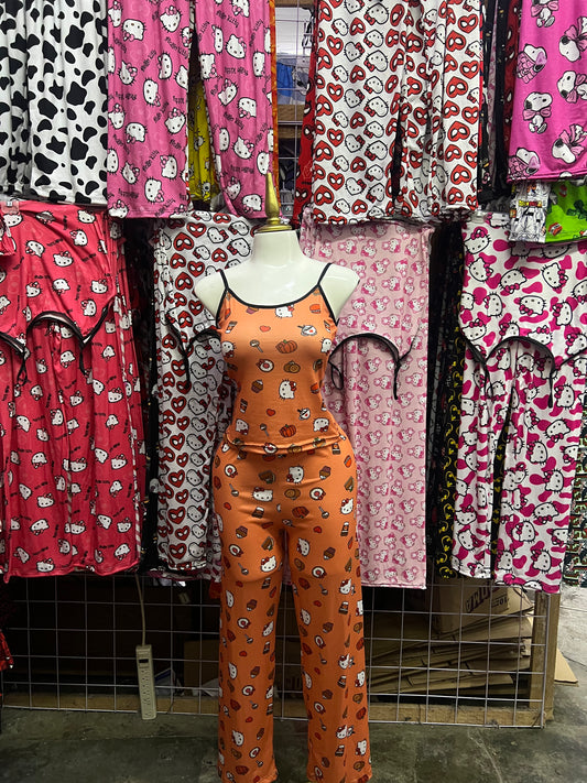 Hello kitty fondo naranja Pijama de dama con blusa y pantalón individual de dama