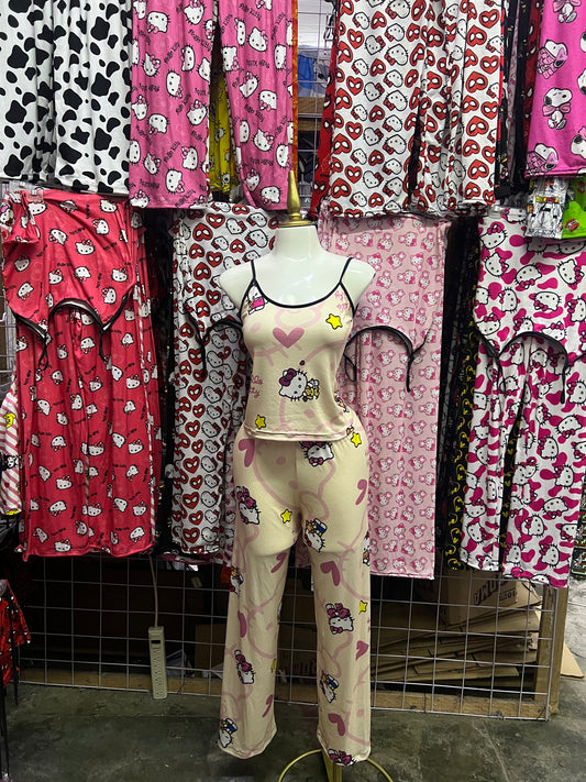 Hello kitty estrellas fondo amarillo Pijama de dama con blusa y pantalón individual de dama