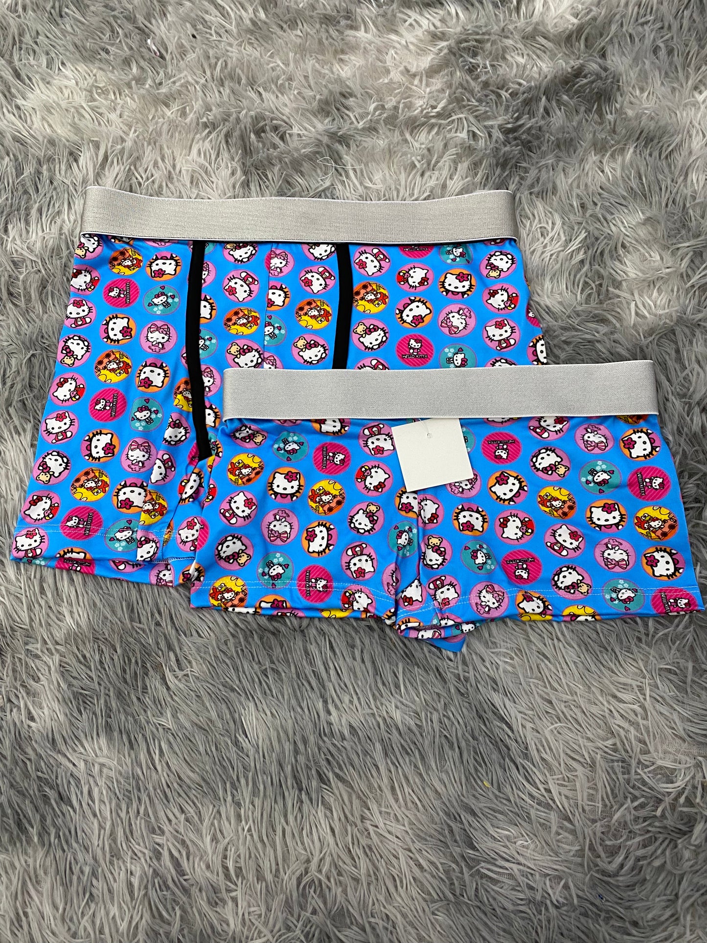 Hello kitty en círculos fondo azul Duo Con Boxer