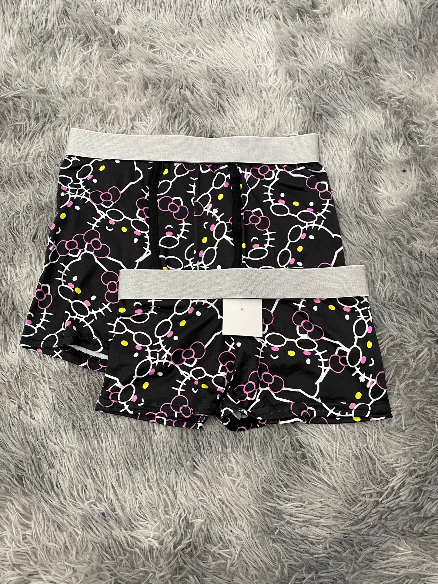 Hello kitty contornos blanco fondo negro Duo Con Boxer